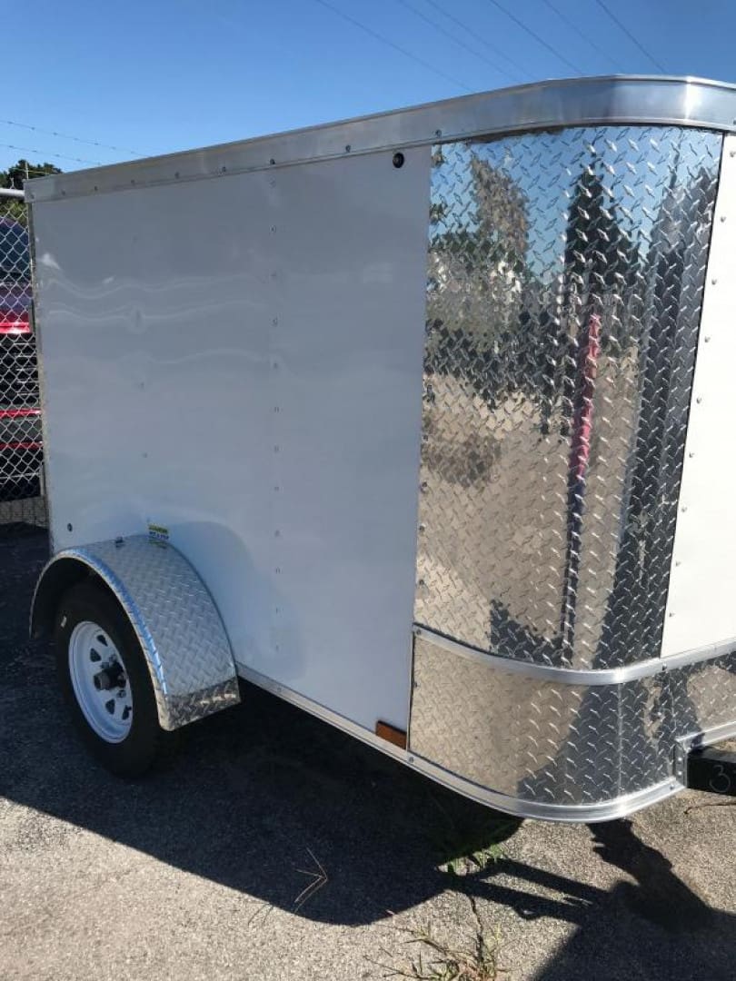 Single-axle trailer with metal trim design.