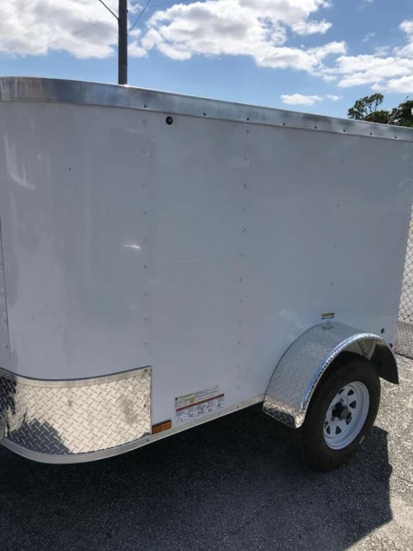 Compact cargo trailer parked outdoors