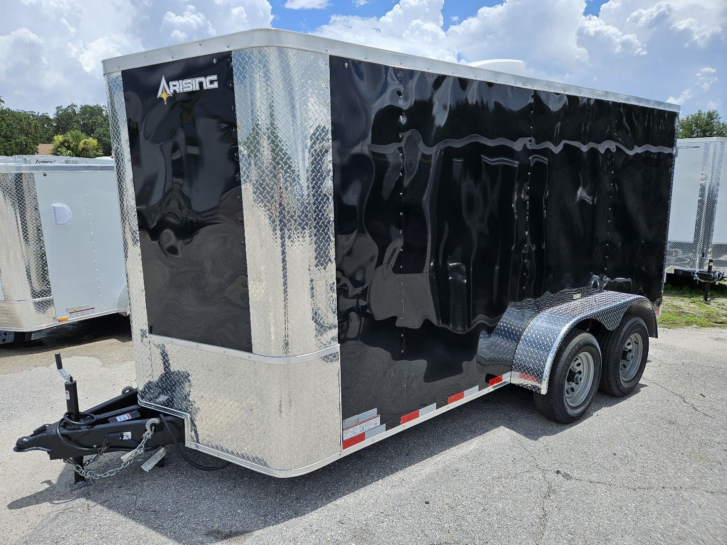 Shiny black enclosed trailer parked outdoors