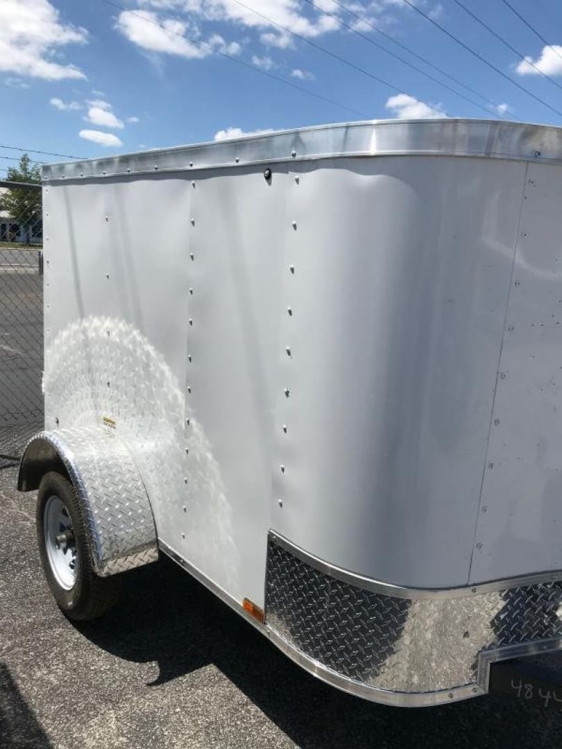 Utility trailer with diamond plate accents