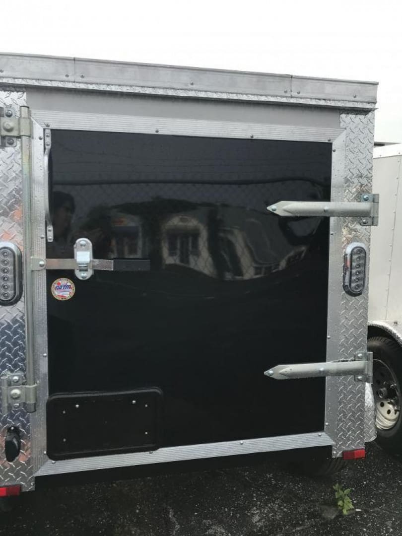 Black utility trailer with metal frame
