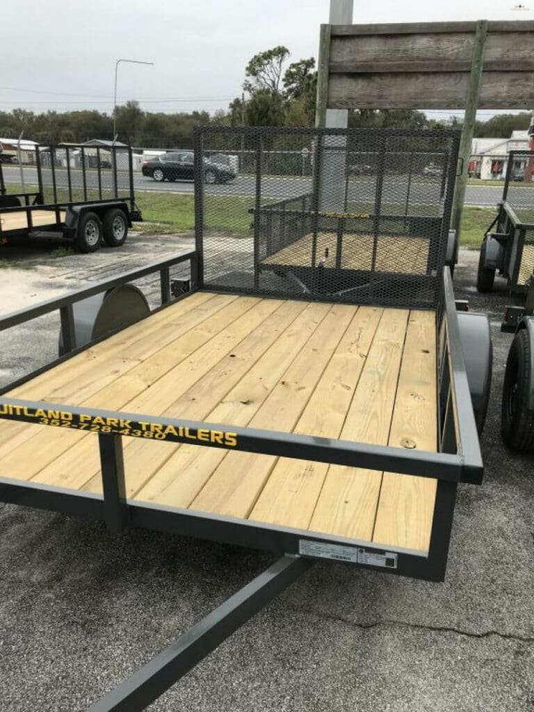 Flatbed utility trailer in parking lot