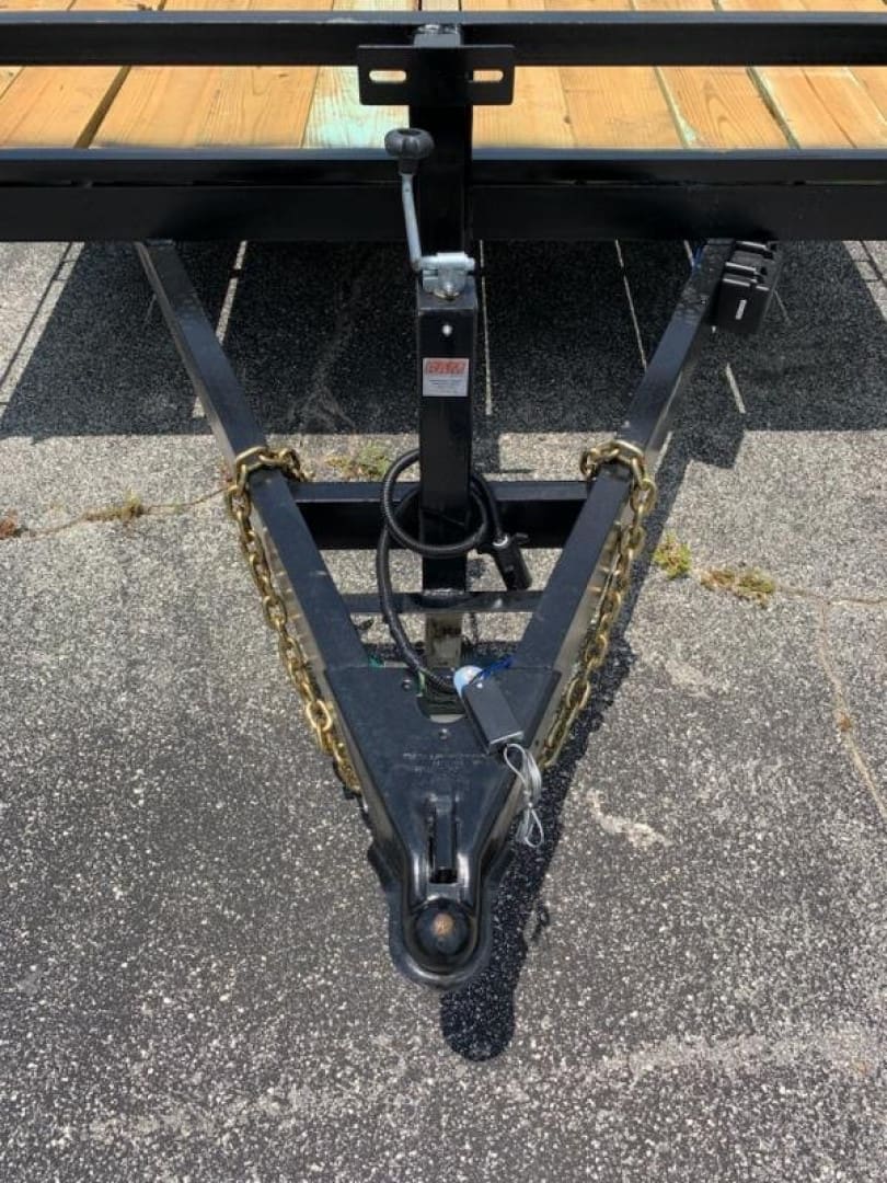 Trailer hitch with safety chains attached