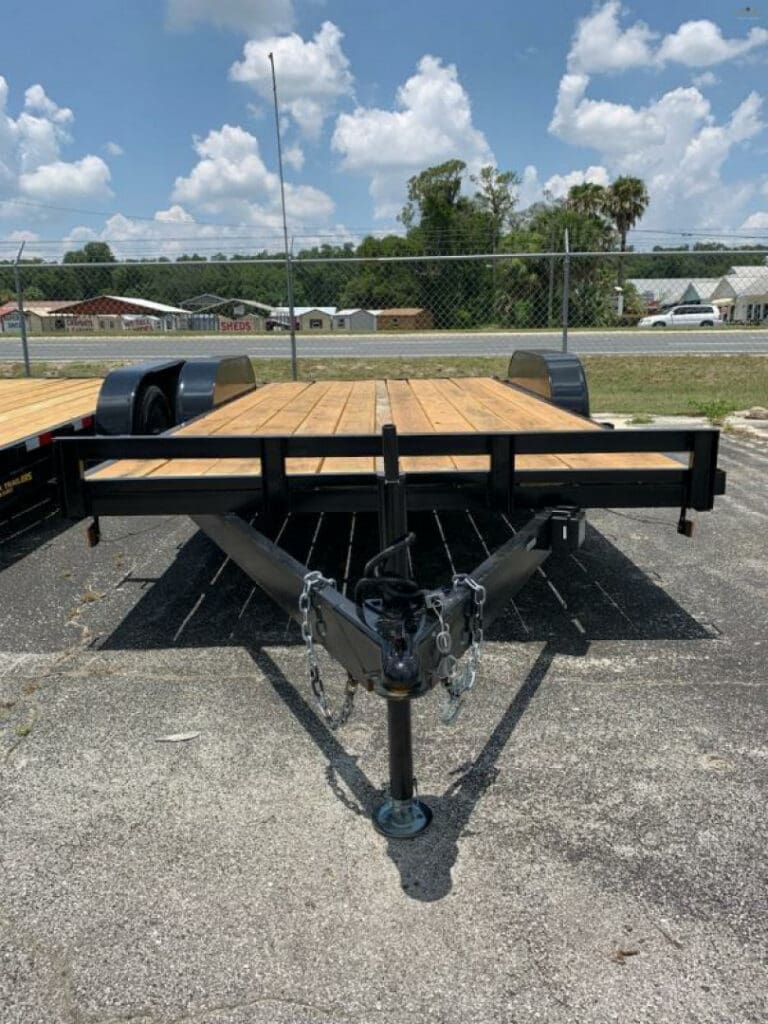 Wooden flatbed trailer under blue sky