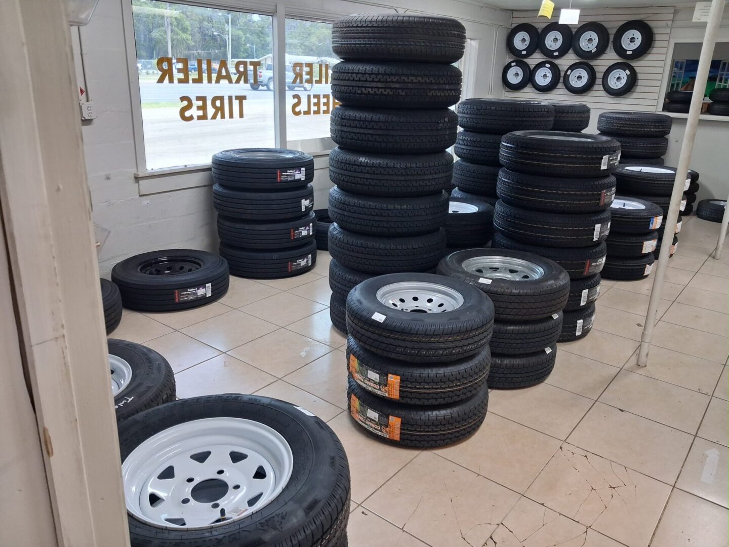 Trailer tires stacked on shop floor