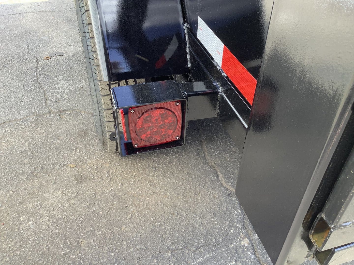 Close-up of trailer light and tire