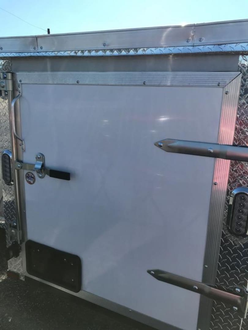 White trailer door with metal hinges