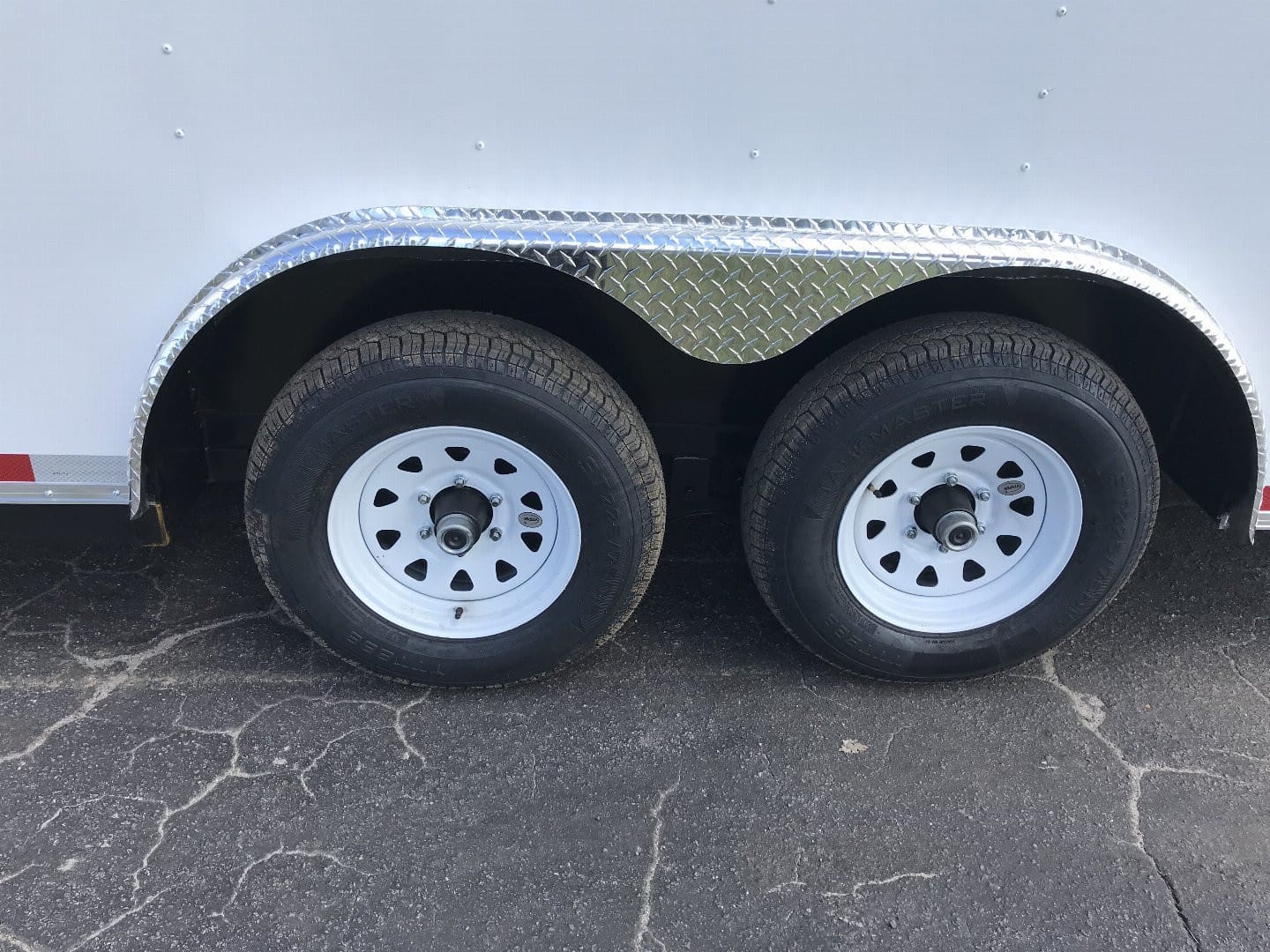 Close-up of trailer wheels and fender