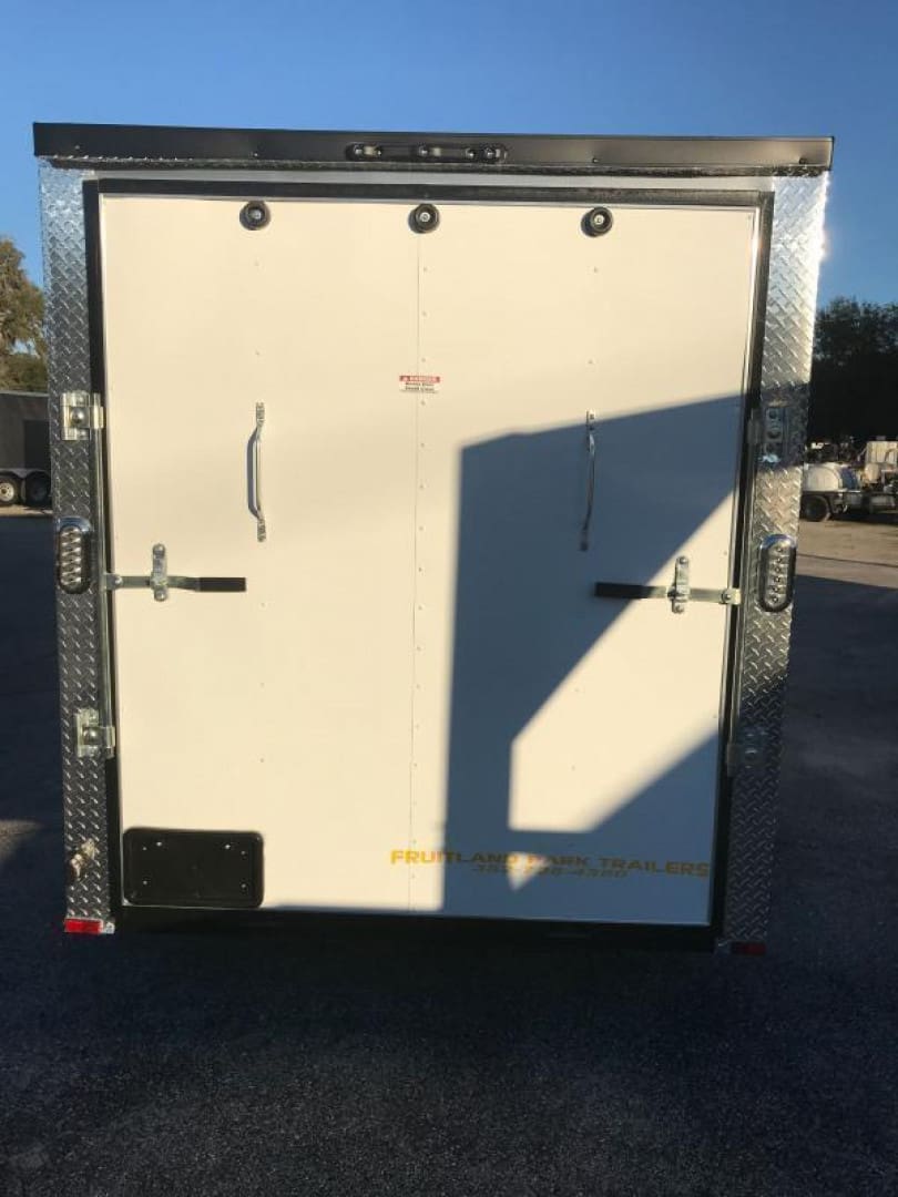 White trailer parked outdoors
