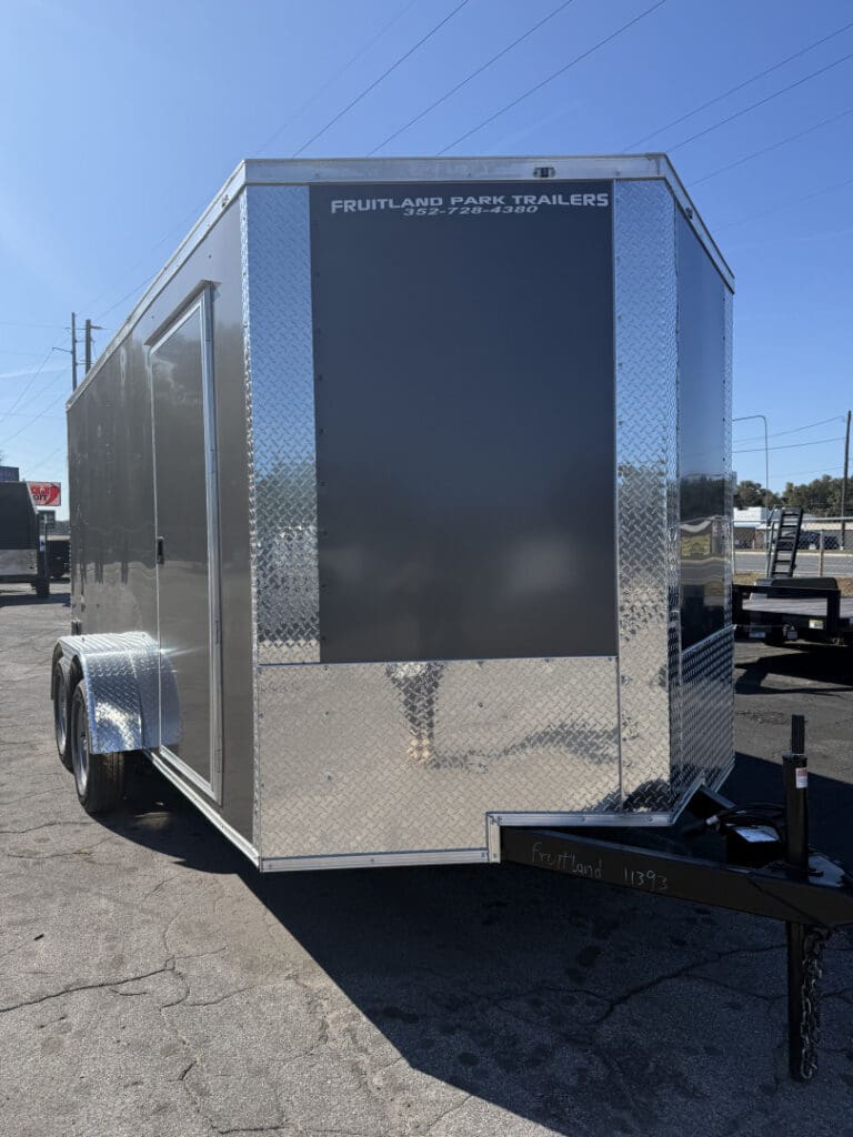 Enclosed trailer parked in a lot.