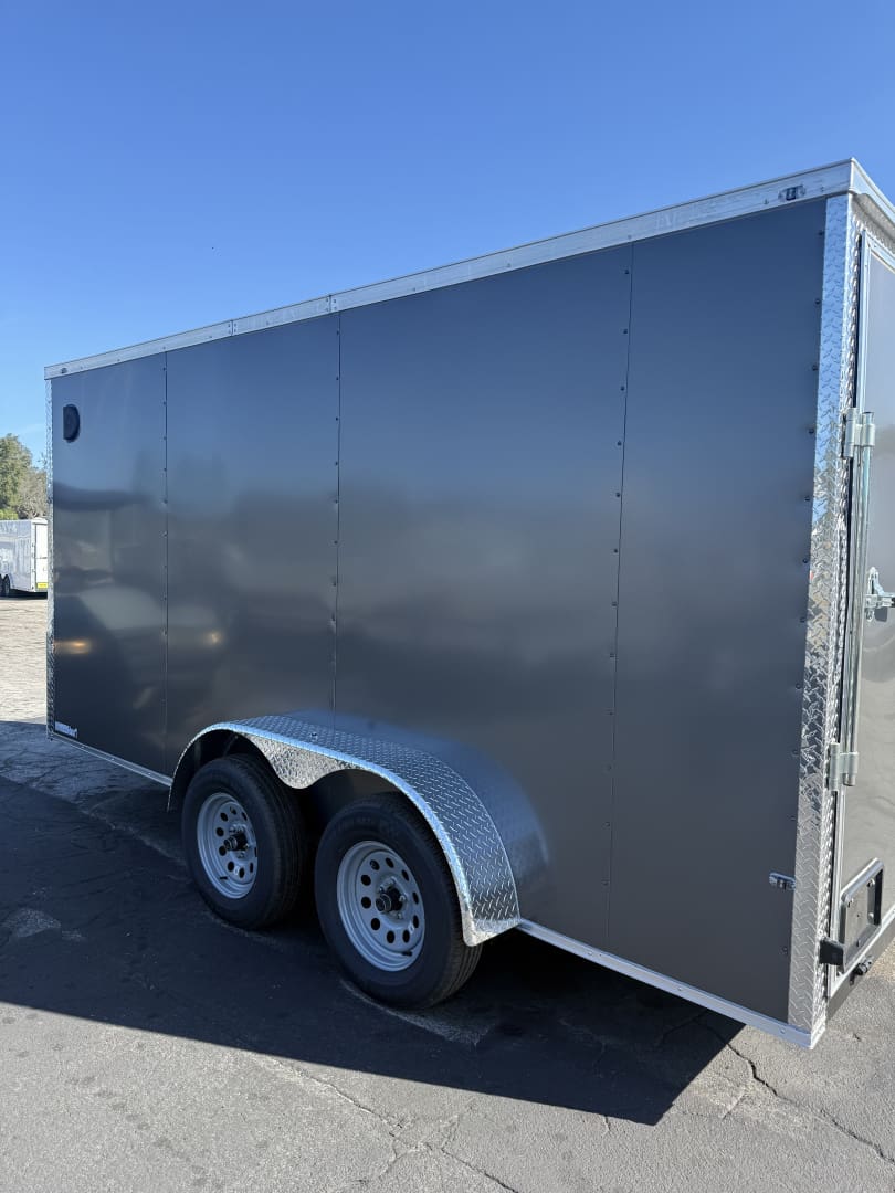 Enclosed trailer parked on asphalt.