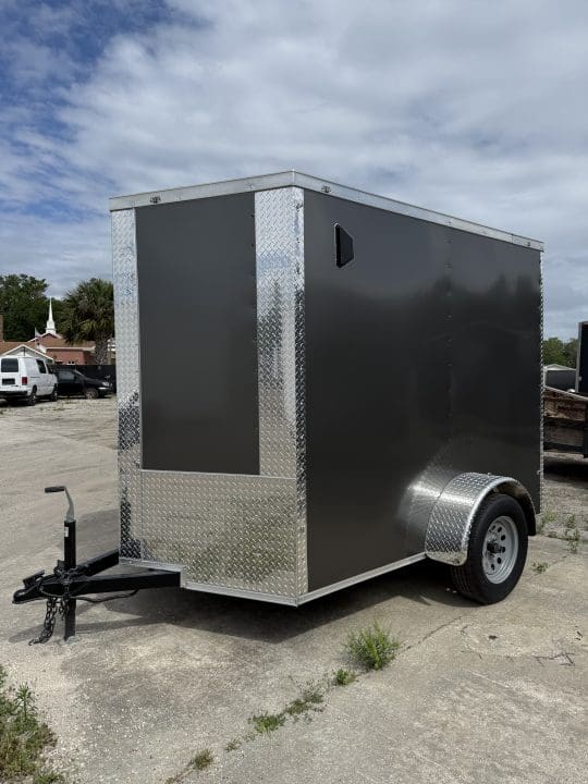 Single-axle trailer under cloudy sky