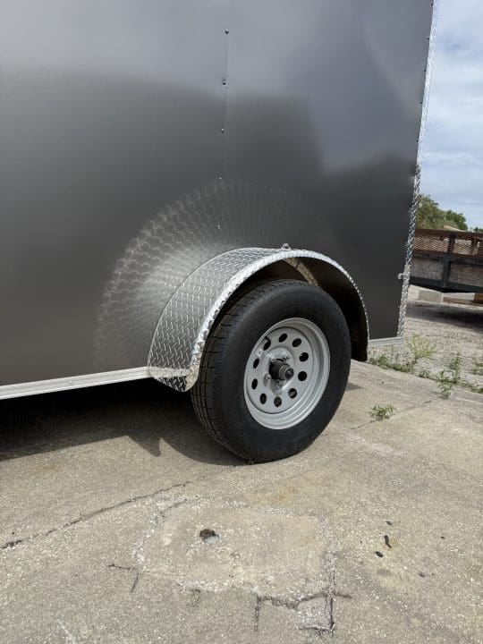 Close-up of trailer wheel and fender