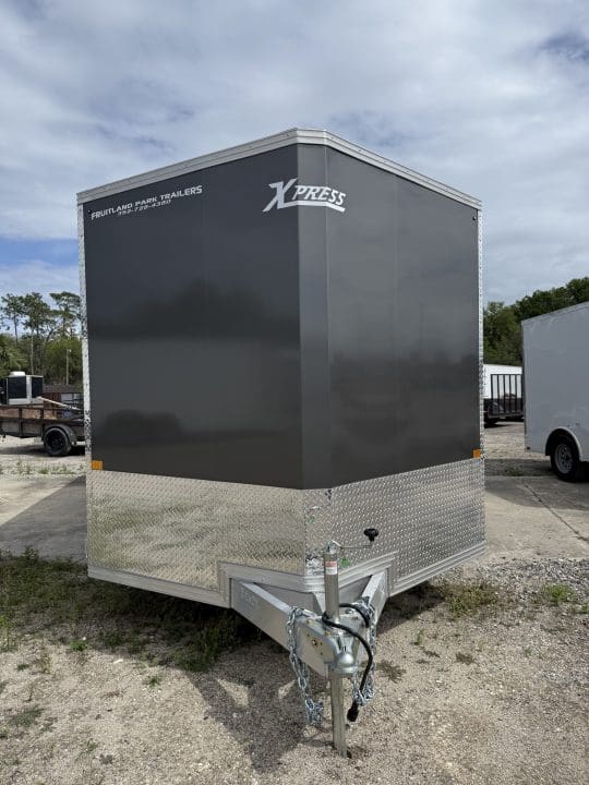 Compact utility trailer with metal front