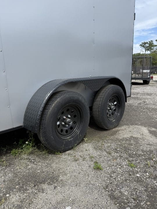 Close-up of trailer tires and fender