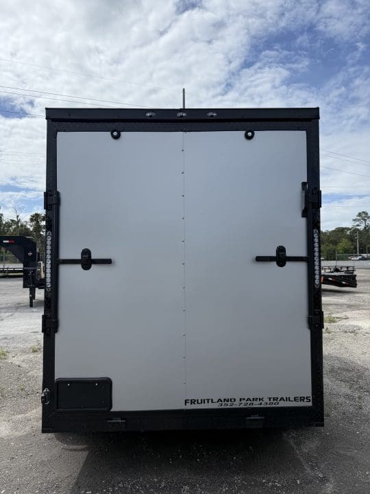 Enclosed trailer with white rear doors