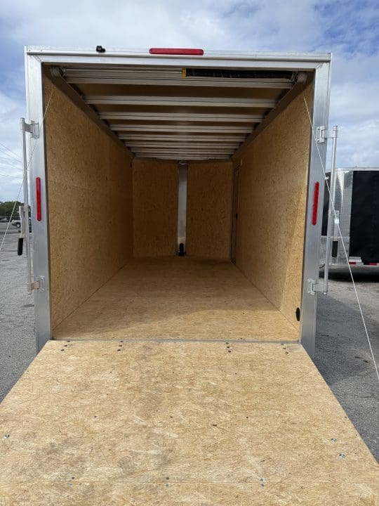 Spacious trailer interior under cloudy sky
