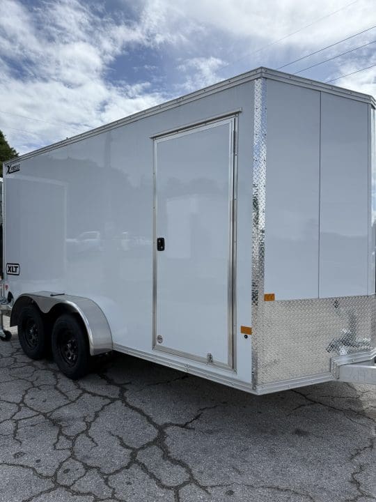 Two-axle utility trailer parked outside