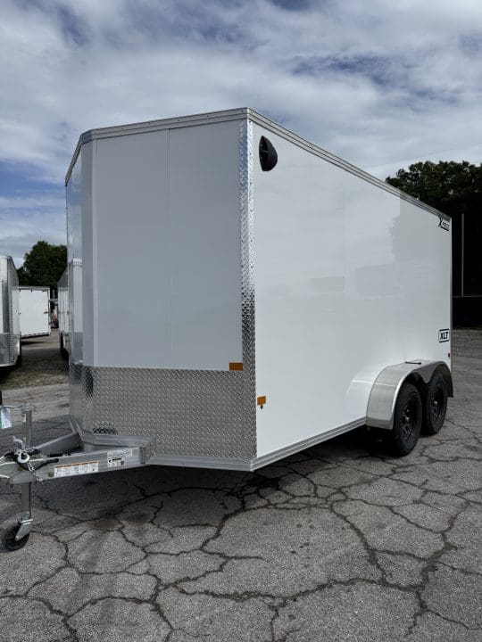 Enclosed trailer under cloudy sky