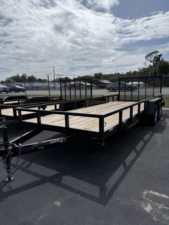 Flatbed trailer parked on asphalt lot