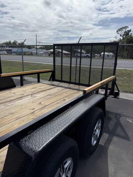 Utility trailer with wooden deck