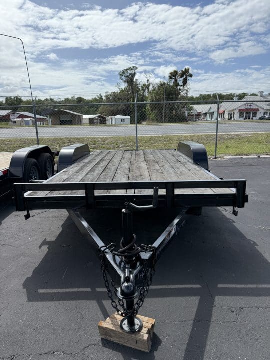 Flatbed trailer parked on asphalt